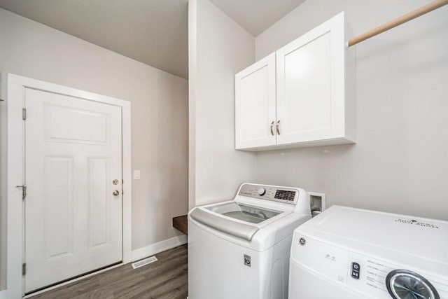 1636 S Redtail Ave, West Des Moines, IA 50265 - washroom with cabinet space, independent washer and dryer, and dark wood finished floors