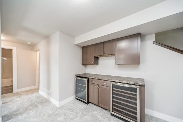 1636 S Redtail Ave, West Des Moines, IA 50265 - indoor dry bar with wine cooler and light colored carpet