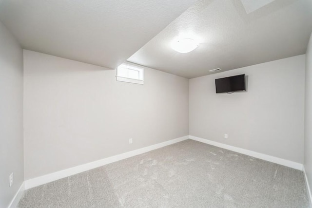 1636 S Redtail Ave, West Des Moines, IA 50265 - basement featuring carpet and a textured ceiling