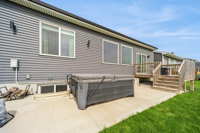 1636 S Redtail Ave, West Des Moines, IA 50265 - rear view of house with a hot tub, a patio, and a deck