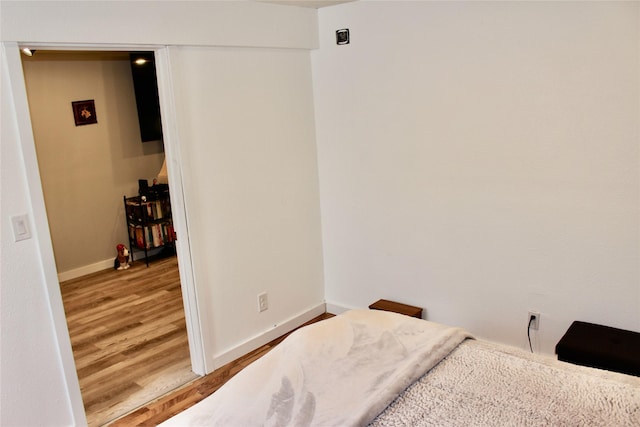 111 S 3rd Ave, Huxley, IA 50124 - bedroom with wood finished floors and baseboards