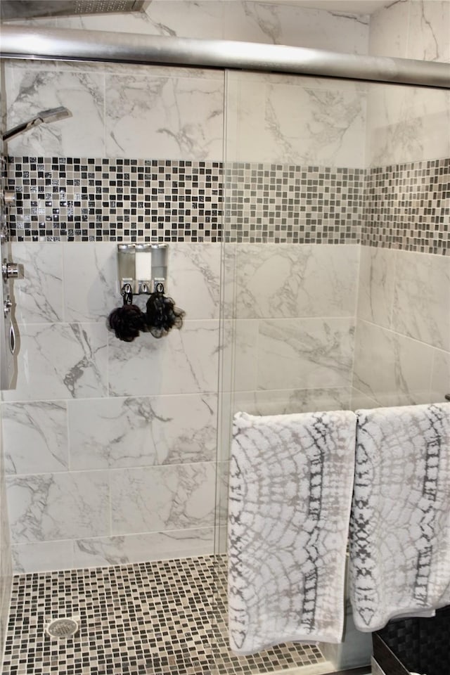 111 S 3rd Ave, Huxley, IA 50124 - full bath featuring tiled shower