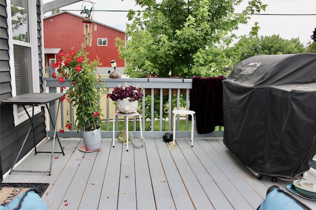 111 S 3rd Ave, Huxley, IA 50124 - wooden deck with a grill