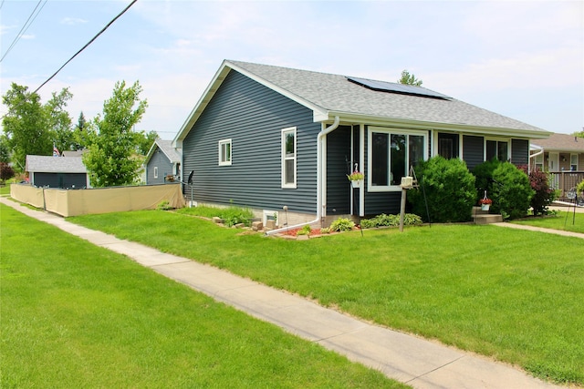 111 S 3rd Ave, Huxley, IA 50124 - view of front facade featuring solar panels and roof with shingles