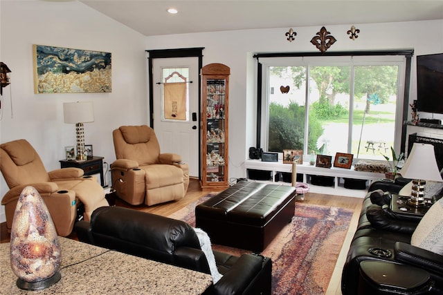 111 S 3rd Ave, Huxley, IA 50124 - living area featuring wood finished floors, recessed lighting, and lofted ceiling
