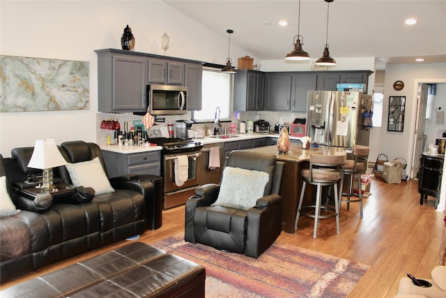 111 S 3rd Ave, Huxley, IA 50124 - living area with light wood-style floors, vaulted ceiling, and recessed lighting