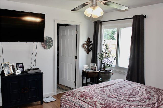 111 S 3rd Ave, Huxley, IA 50124 - bedroom featuring wood finished floors and ceiling fan