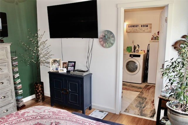 111 S 3rd Ave, Huxley, IA 50124 - laundry room with washer / clothes dryer and wood finished floors