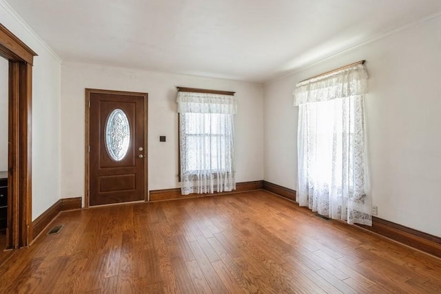 1236 York St, Des Moines, IA 50316 - foyer featuring wood finished floors and crown molding