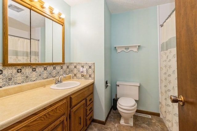 202 Harrison Ct, Baxter, IA 50028 - bathroom featuring vanity and tasteful backsplash