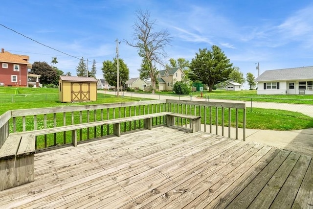 202 Harrison Ct, Baxter, IA 50028 - deck featuring a shed and a residential view