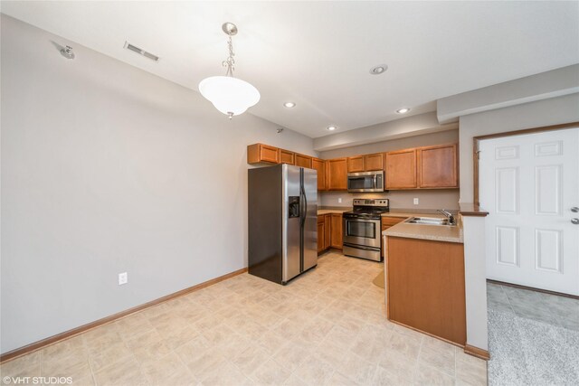 1624 NW Prairie Lakes Dr Unit 4, Ankeny, IA 50023 - kitchen featuring appliances with stainless steel finishes, light countertops, hanging light fixtures, recessed lighting, and brown cabinets