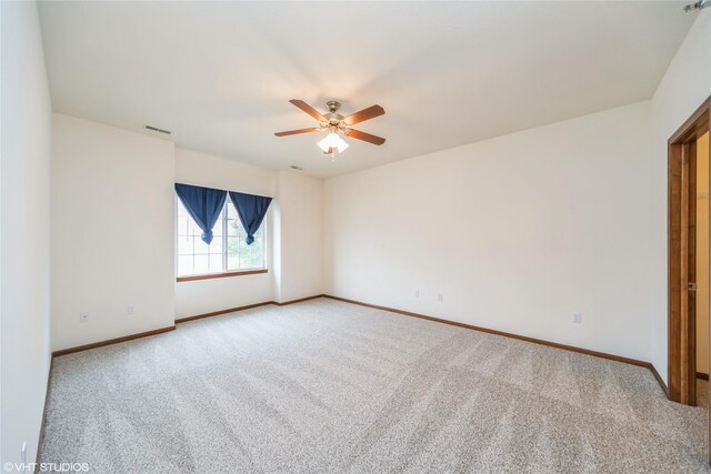1624 NW Prairie Lakes Dr Unit 4, Ankeny, IA 50023 - carpeted spare room with a ceiling fan and baseboards