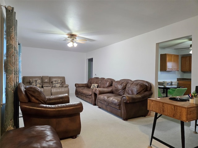 335 Palomino Pkwy, Des Moines, IA 50320 - living room with a ceiling fan, light carpet, and a desk