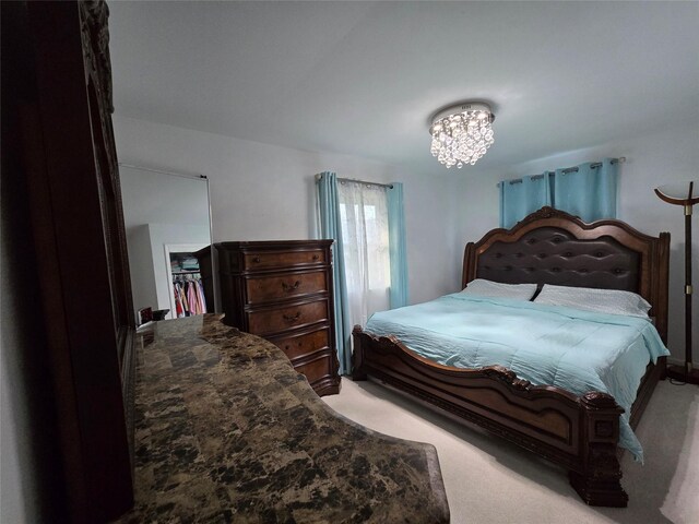 335 Palomino Pkwy, Des Moines, IA 50320 - carpeted bedroom featuring a chandelier