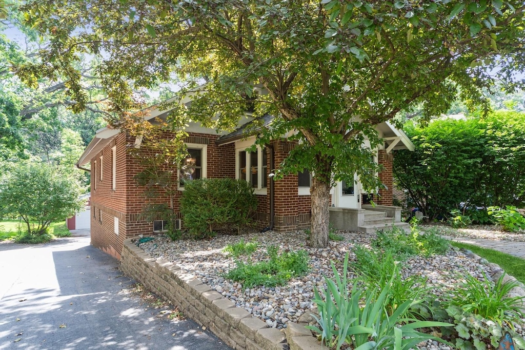 2005 34th St, Des Moines, IA 50310 - view of property exterior with brick siding