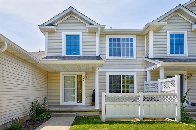 57 SE Meadowlark Ct, Waukee, IA 50263 - view of front of home with a porch and a shingled roof