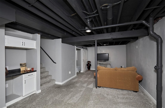 57 SE Meadowlark Ct, Waukee, IA 50263 - finished basement with light carpet and stairway