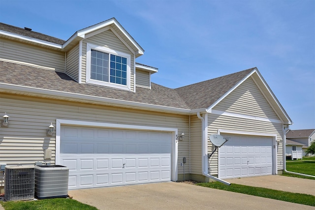 57 SE Meadowlark Ct, Waukee, IA 50263 - garage featuring concrete driveway