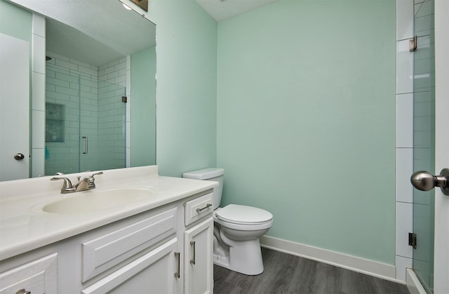 57 SE Meadowlark Ct, Waukee, IA 50263 - bathroom with wood finished floors, vanity, and a shower stall