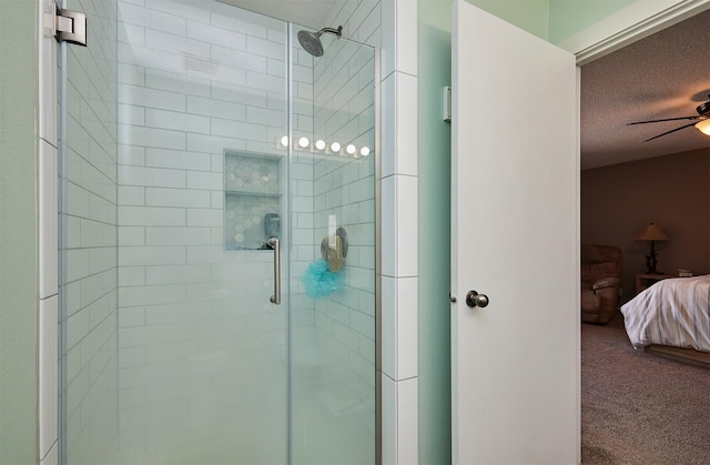 57 SE Meadowlark Ct, Waukee, IA 50263 - full bathroom featuring ensuite bath, a stall shower, a textured ceiling, and ceiling fan