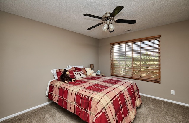 57 SE Meadowlark Ct, Waukee, IA 50263 - bedroom with carpet, a textured ceiling, and a ceiling fan