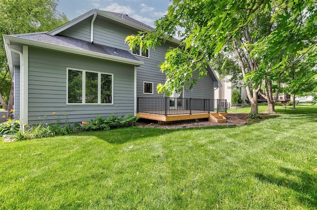 8151 Chambery Blvd, Johnston, IA 50131 - rear view of property with a deck, a lawn, and a shingled roof