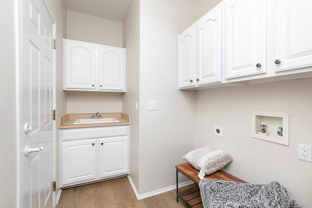 8151 Chambery Blvd, Johnston, IA 50131 - laundry area featuring hookup for an electric dryer, cabinet space, light wood-style flooring, and hookup for a washing machine