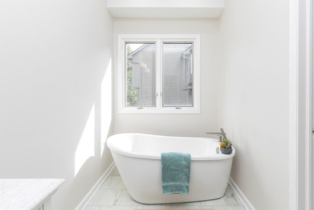 8151 Chambery Blvd, Johnston, IA 50131 - full bath with marble finish floors and a freestanding bath