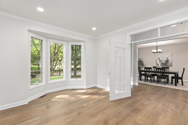 8151 Chambery Blvd, Johnston, IA 50131 - empty room featuring crown molding, a chandelier, wood finished floors, and recessed lighting
