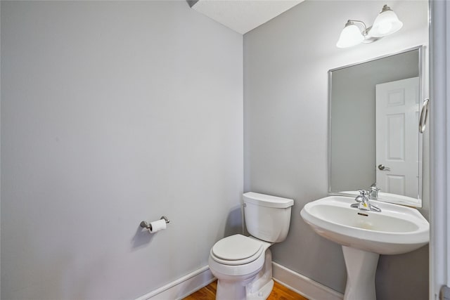 4108 158th Cir, Urbandale, IA 50323 - half bathroom featuring toilet and wood finished floors