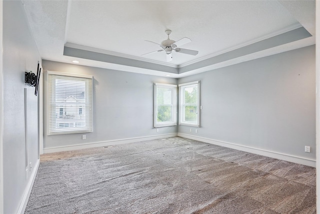 4108 158th Cir, Urbandale, IA 50323 - carpeted spare room with a tray ceiling, crown molding, and a ceiling fan
