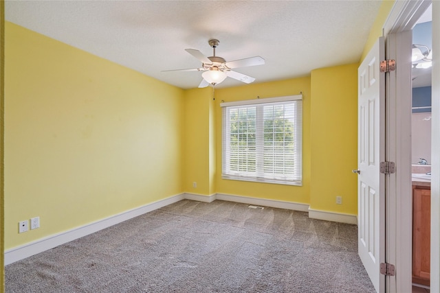 4108 158th Cir, Urbandale, IA 50323 - unfurnished room with carpet, ceiling fan, and a textured ceiling