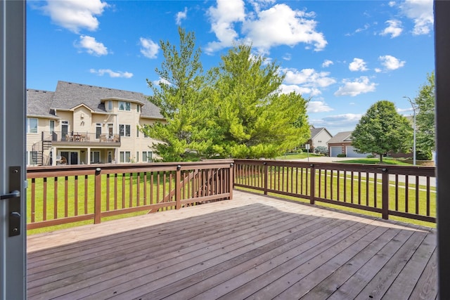 4108 158th Cir, Urbandale, IA 50323 - wooden terrace featuring a residential view and a lawn