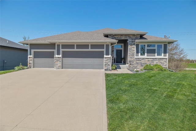 3210 NE 17th St, Ankeny, IA 50021 - prairie-style home with stone siding, a front yard, concrete driveway, a garage, and roof with shingles