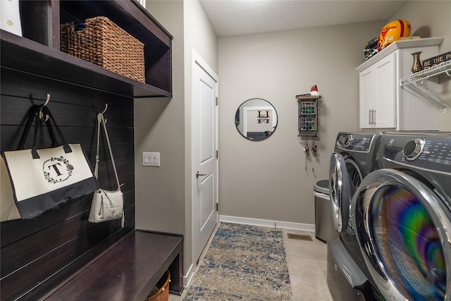 3210 NE 17th St, Ankeny, IA 50021 - laundry area with independent washer and dryer, cabinet space, and light tile patterned flooring