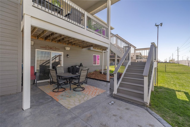 3210 NE 17th St, Ankeny, IA 50021 - view of patio with stairs, outdoor dining space, and a deck