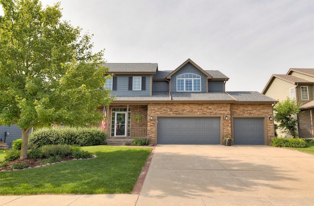 12602 Winston Ave, Urbandale, IA 50323 - view of front of home featuring concrete driveway, a front yard, and a garage