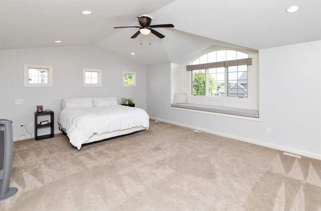12602 Winston Ave, Urbandale, IA 50323 - carpeted bedroom featuring multiple windows, recessed lighting, vaulted ceiling, and a ceiling fan