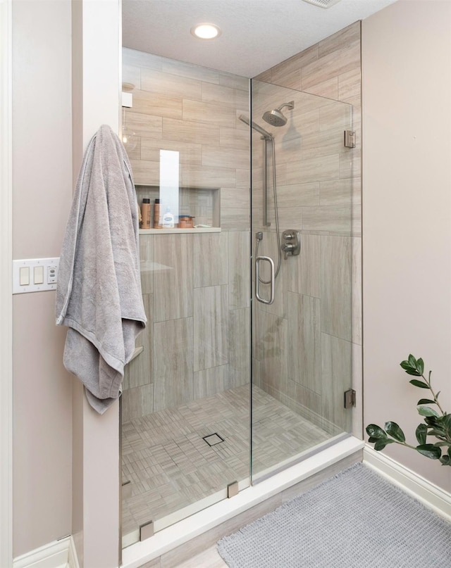 12602 Winston Ave, Urbandale, IA 50323 - full bathroom with a stall shower and recessed lighting