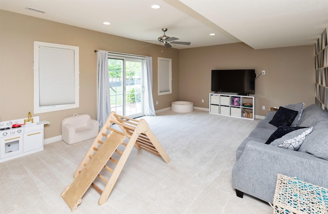 12602 Winston Ave, Urbandale, IA 50323 - carpeted living room with ceiling fan and recessed lighting