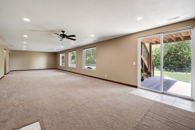 300 NW Sunset Ln, Grimes, IA 50111 - spare room featuring light carpet, a ceiling fan, and recessed lighting