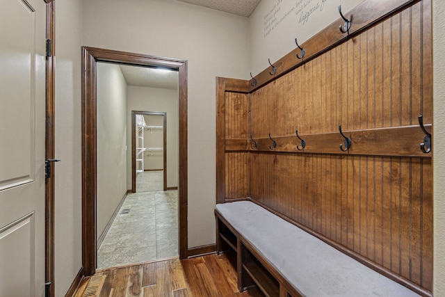 300 NW Sunset Ln, Grimes, IA 50111 - mudroom featuring wood finished floors and a textured ceiling