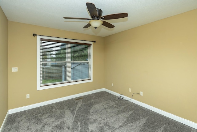 1736 Ashwood Dr SW, Altoona, IA 50009 - spare room featuring dark carpet, a ceiling fan, and a textured ceiling