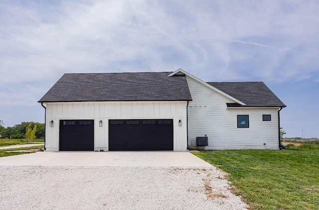 1103 170th St, Dexter, IA 50070 - view of front of home with driveway, an attached garage, a front yard, and a shingled roof