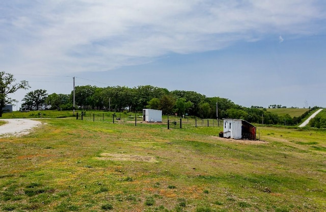 1103 170th St, Dexter, IA 50070 - view of yard with a storage shed and a view of countryside