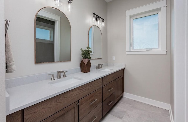 1103 170th St, Dexter, IA 50070 - full bathroom with double vanity and baseboards