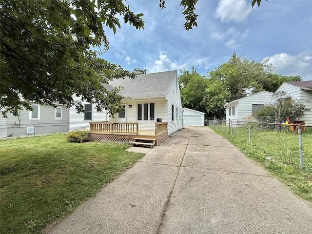 2000 E 21st St, Des Moines, IA 50317 - view of front of property featuring a deck, an outdoor structure, a shingled roof, and a detached garage