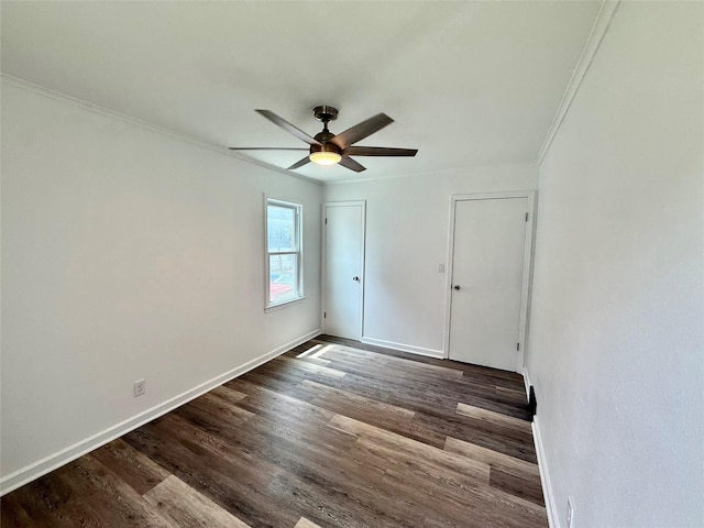 2000 E 21st St, Des Moines, IA 50317 - unfurnished bedroom with crown molding, dark wood-type flooring, and ceiling fan