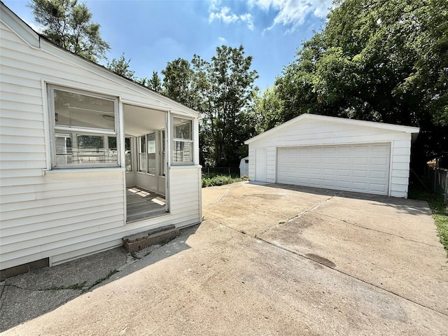 2000 E 21st St, Des Moines, IA 50317 - view of home's exterior featuring a garage and an outbuilding